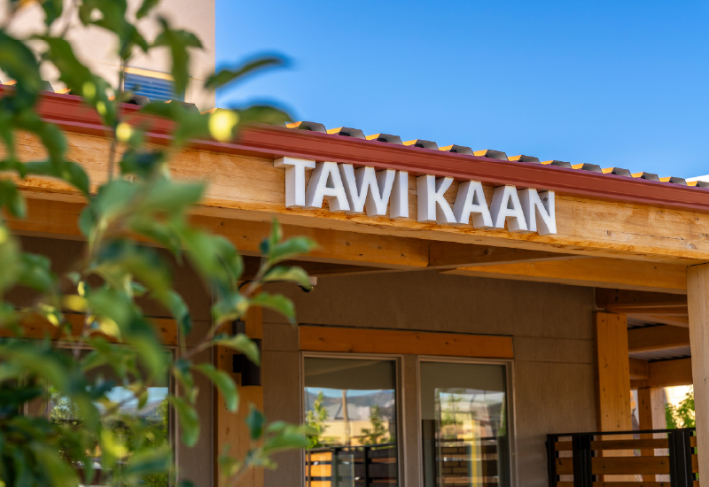Tawi Kaan apartment signage on outside of building
