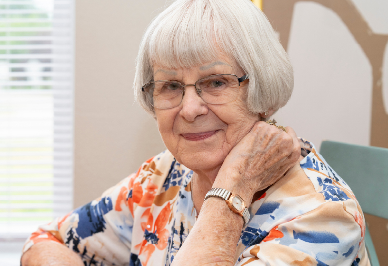 A resident of Deer Run smiling at the camera