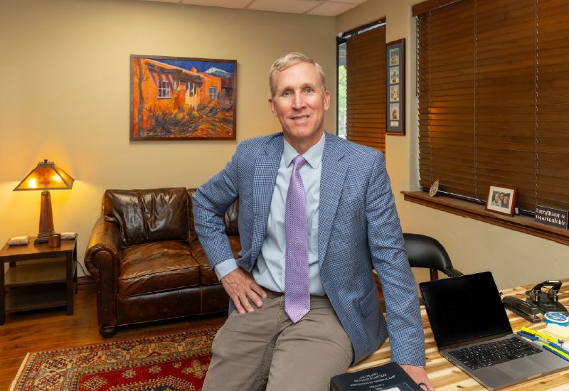 A man sitting on a desk