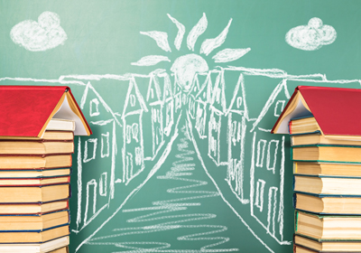 A chalk drawing of a row of homes with the front two made out of stacks of books