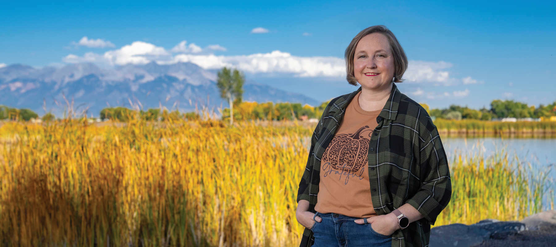 Dawn Melgares standing in front of a lake