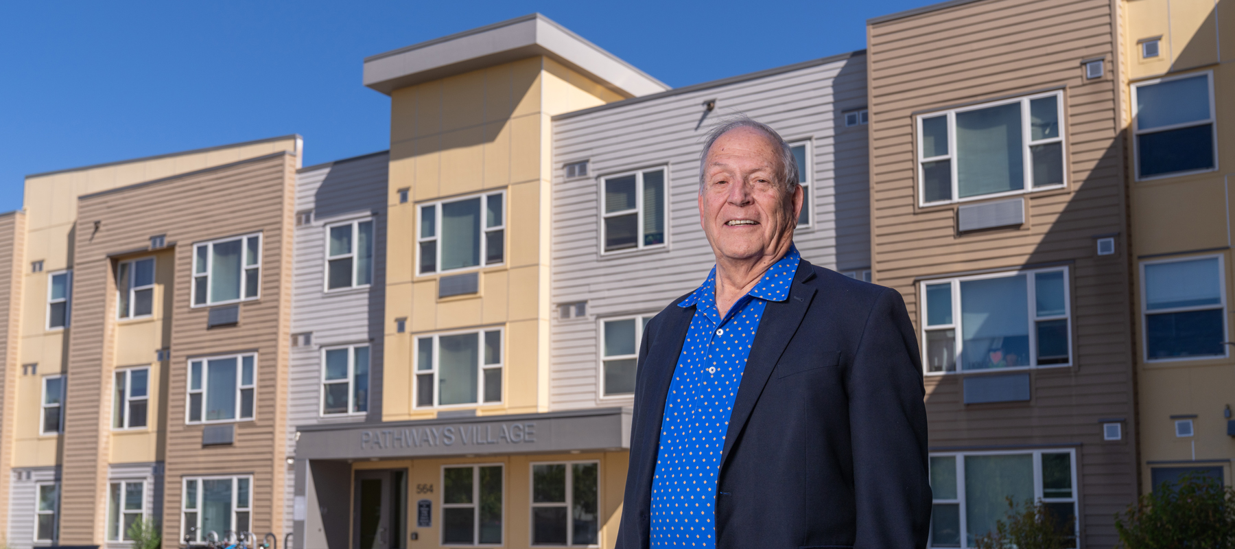 William Wade standing in front of a building