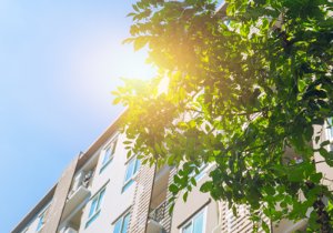 An upward look at multifamily building with backlight