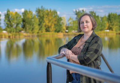 Dawn Melgares standing in front of a body of water