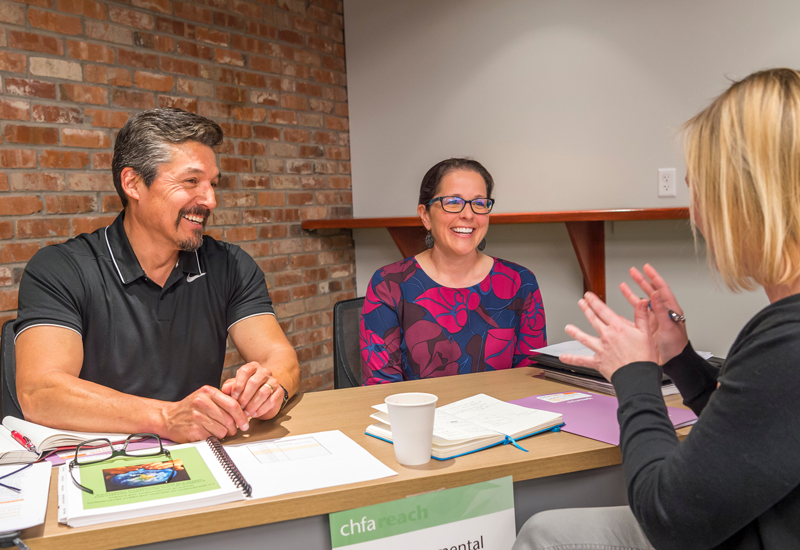 Employees chatting and smiling