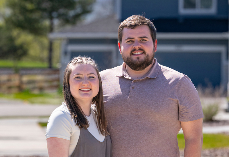 Alyssa and Ryan standing in their neighborhood