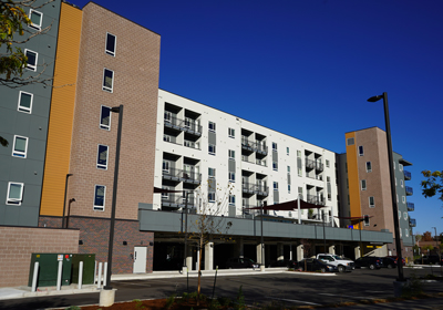 A multifamily building and blue sky