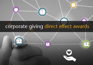 A hand drawing a web of icons with overlay text that reads corporate giving direct effect awards