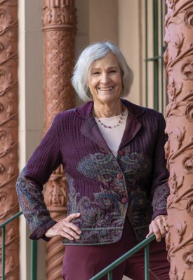 Grace Buckley standing in front of ornate pillars