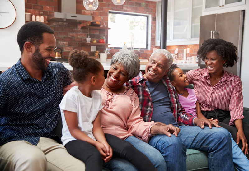 multigenerational family sitting on a couch