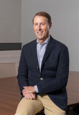 Cris White smiling at the camera