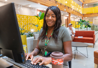 A woman on a laptop at Mason Place