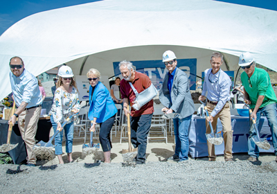 Residences at Delta groundbreaking - a group of people with shovels