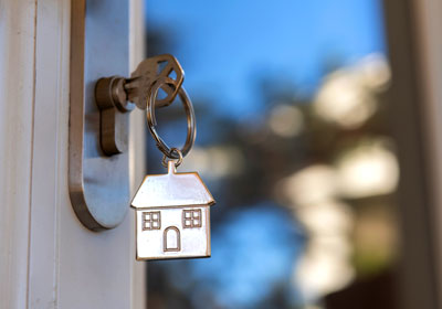 door with a key and house keychain