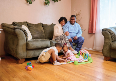 A family sitting in their living room