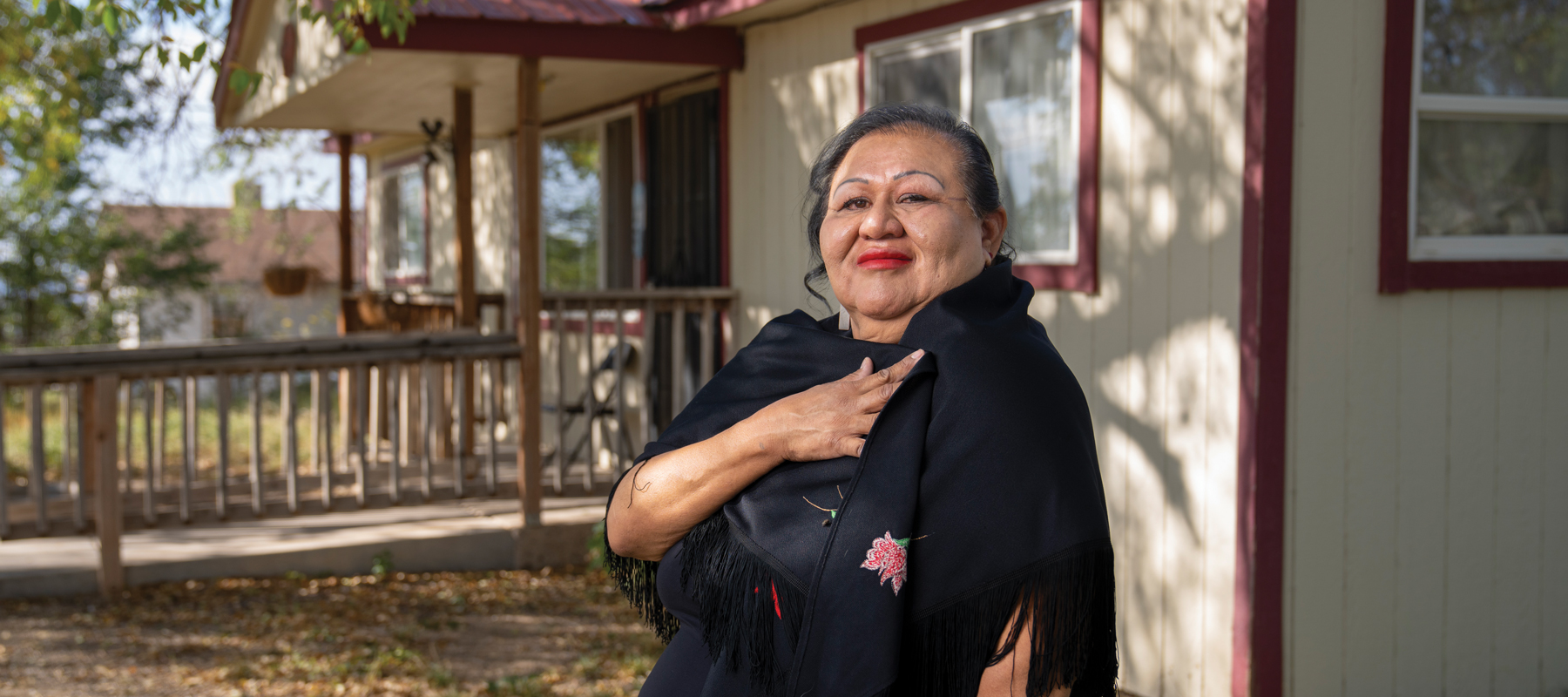 Bernadette Cuthair standing in front of a building