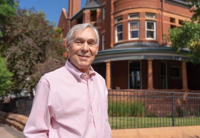 Jim Roberts in front of an historic home