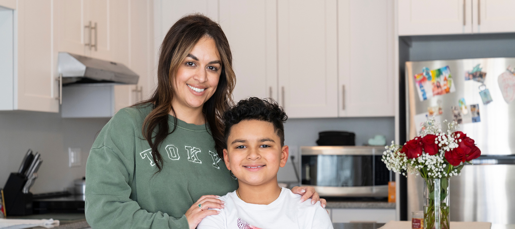 A mother and son in a kitchen