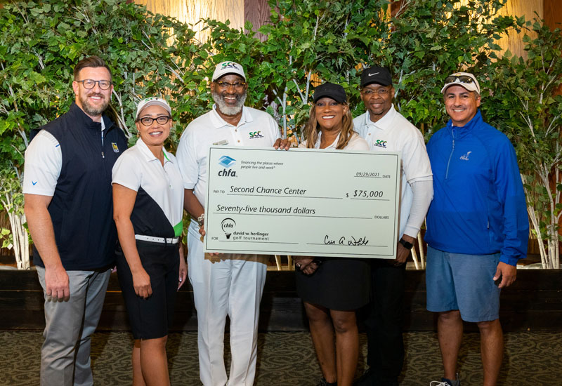 Second Chance Center with CHFA Execs holding check