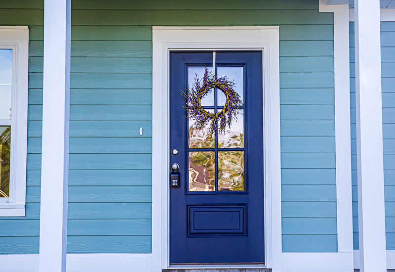 Dark blue door with blue wreath