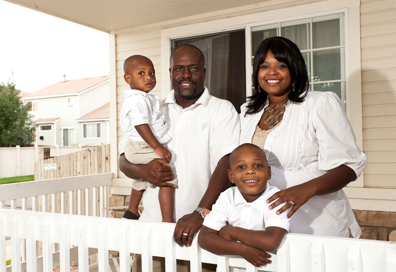 Black African American Family on Porch of Home